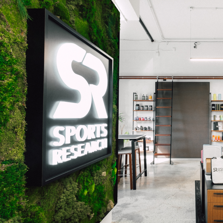 a sports research store with moss growing on the wall.