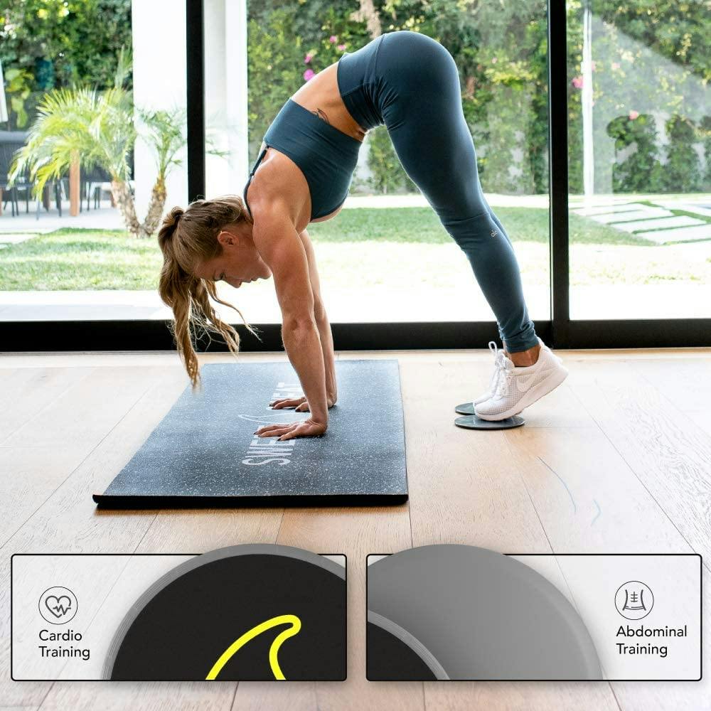 Woman using Sweet Sweat® core sliders and Sweet Sweat® yoga mat to work out.