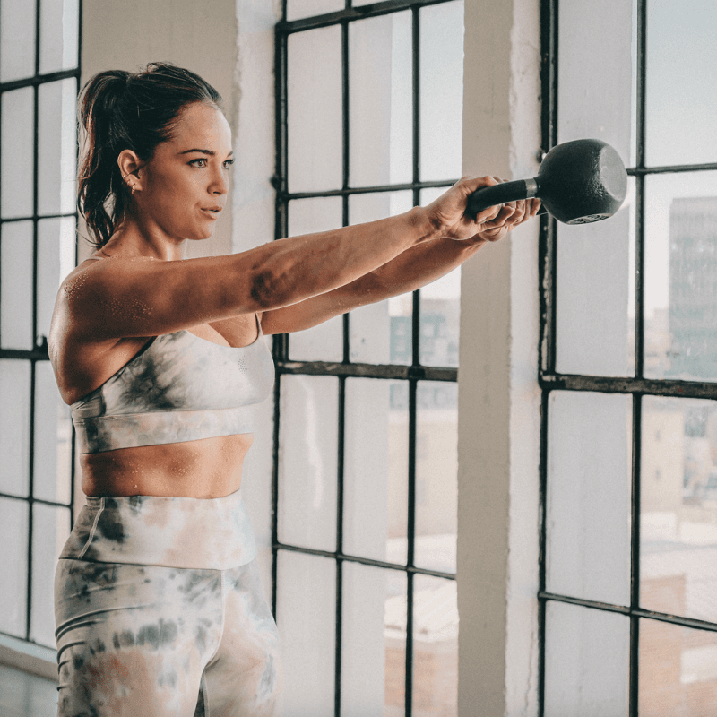Woman working out with dumbbell